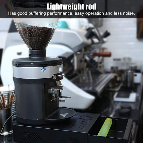 Sleek Stainless Steel Coffee Knock Box Featuring A Detachable Drawer Removable Rubber Knock Bar And Steady Non Slip Pads For Quick Home Espresso Cleanup on a kitchen counter.