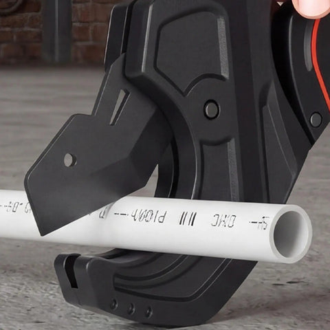 Close-up of a Ratcheting PVC CPVC Pipe Cutter with Wide Jaw Opening and Anti Fatigue Grip cutting a white pipe