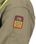 Workhorse Flame Resistant Coveralls Featuring Bold High Visibility Striping And Soft Cotton Nylon Blend For Straight Up Comfortable Daily Hazardous Environment Safety Wear patch detail on sleeve