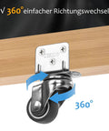 Battle Ready Caster Set Of Four Heavy Duty Thermoplastic Rubber Locking Swivel Wheels With Retractable Brakes For Workshop Tables Rolling Carts And Heavy Gear Silver 1.25 Inch close-up of 360-degree swivel caster on wooden surface.