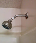 Installed showerhead with visible Pro Grade PTFE Thread Seal Tape For Plumbers 1 Inch By 520 Inch Go To Leak Proof Sealant.