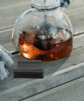 Rubber Steam Wand Cover For Espresso Machines Heat Resistant Insulation Sleeve on wooden surface beside glass teapot