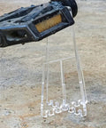 Lightweight Portable Bicycle Stand For Parking And Display holding bike pedal, acrylic material, for road and mountain bike stability.