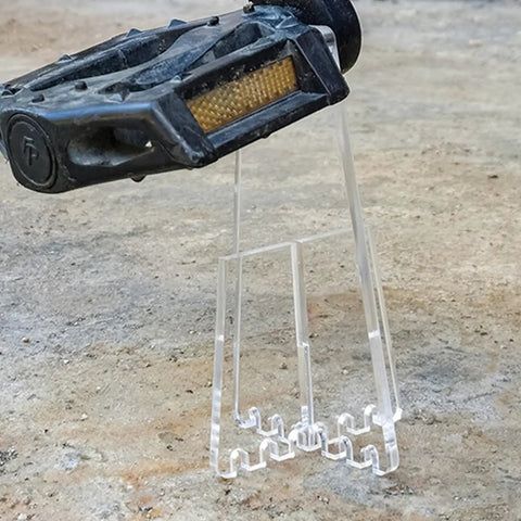Lightweight Portable Bicycle Stand For Parking And Display holding bike pedal, acrylic material, for road and mountain bike stability.