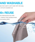 SmoTecQ gray microfiber cleaning cloth held in hand (front view).