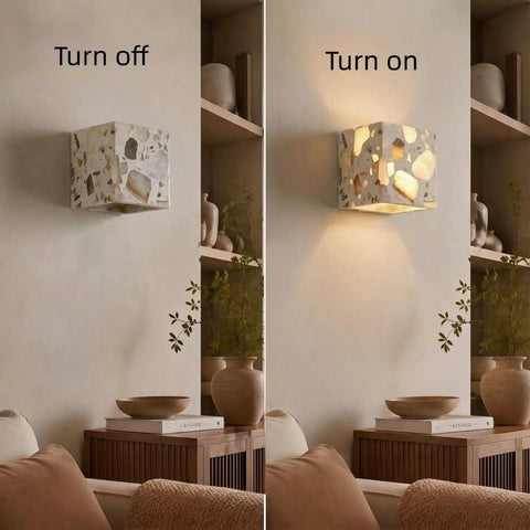 4.7" Mid Century Modern Wall Sconce, Minimalist Terrazzo Wall Light Fixture turned on, showcasing dappled light effects.