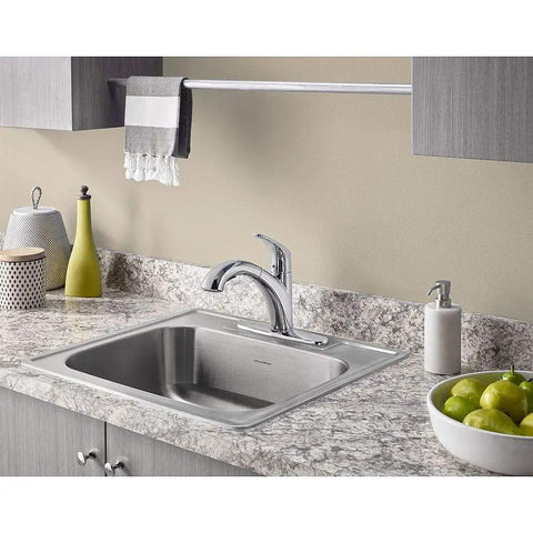 Colony Pro Pull Out Kitchen Faucet with Dope Sprayer and Ceramic Disc Valve installed in a granite countertop with chrome finish.