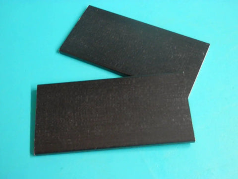 Two black fiberglass panels, Swivel Rocker Spring Plates Replacement Parts Two Pack Two And A Half Inch By Five Inch By One Quarter Inch