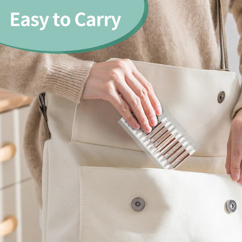 Person placing Travel Ready Iodine Swabs With Snap And Flow Technology, Premium Organic Cotton Tips, 100 Count, into a bag pocket