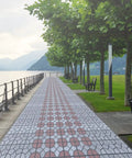 Scenic outdoor path made with Two Pack Easy To Use DIY Concrete Molds And Forms For Garden Walkways And Patios 15.7 Inch Square 1.6 Inch Thick Reusable Cement Molds For Pathway Pavement Stepping Stones Outdoor Yard Patio, lined with trees by a lake.