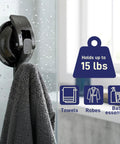 Heavy Duty Vacuum Suction Cup Hooks Black 2 Pack For Smooth Walls And Glass Zero Drama Mounting Hella Strong Suction Grip No Drill Needed For Bathroom Kitchen Setup And Dope Home Storage Solutions with towel hanging in shower.