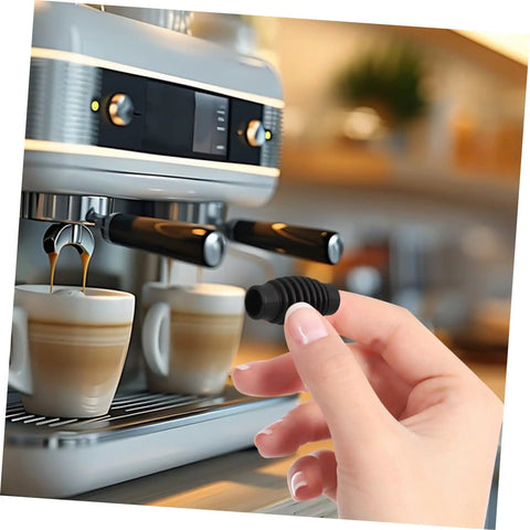Hand holding Espresso Steam Wand Heat Insulation Sleeve Anti Burn Rubber Wrap For Coffee Machines next to espresso machine.