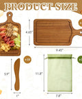 Front view of a ten-piece acacia mini wooden charcuterie board set with handled boards, spatula, and organza bag.