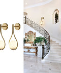Globe Glass Wall Sconce Set Of 2 Brushed Metal Modern Bathroom Light Fixtures in elegant foyer with decorative staircase.