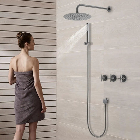 Shower System Wall Mounted 10 Inch Stainless Steel Rain Shower with a woman standing under the rain shower in a modern bathroom.