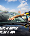 Person using Streak Free Glass Cleaning Wipes Canister For Home And Auto Lint Free Ammonia Free Tint Safe Wipes on car windshield.