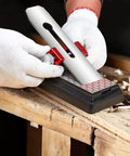 Person using Upgraded Honing Guide Tool for Short Chisels and Planes, Off Center Sharpening Holder With Adjustable Angles, Red on bench