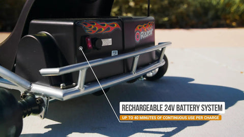 Close-up of a Razor go-kart showing the rechargeable 24V battery, part of Electric GoKart For Kids 8 And Up With 12 MPH Top Speed Up To 40 Minutes Of Ride Time 24V Rechargeable Battery Variable Speed Throttle Durable Steel Frame And Aluminum Wheels.