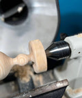 Carbide Tipped Wood Lathe Live Center 2MT Morse Taper Shank With 8mm Carbide Tip on a lathe engaged in woodturning.