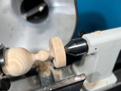 Carbide Tipped Wood Lathe Live Center 2MT Morse Taper Shank With 8mm Carbide Tip on a lathe engaged in woodturning.
