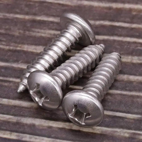 Heavy Duty Tough As Nails 304 Stainless Steel Pan Head Sheet Metal Screws Phillips Drive Self Tapping Rust Resistant Hardware For Wood And Metal Projects Pack Of Fifty close-up of three screws.