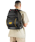 Person wearing 18-Inch Pro Tool Backpack With 32 Pockets For Gear Storage, Heavy-Duty 1680D Water-Resistant Polyester, Molded Bottom, Padded Shoulder Support