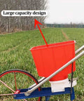 Hand Push Garden Seeder Walk Behind Row Planter Manual Seeder Machine with large capacity seed and fertilizer box in a field