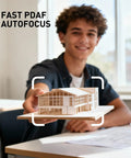 Student holding a Miniature Architecture Model demonstrating Total Game Changer 4K Center Screen Webcam With Punchy Mic And Lightning Autofocus.