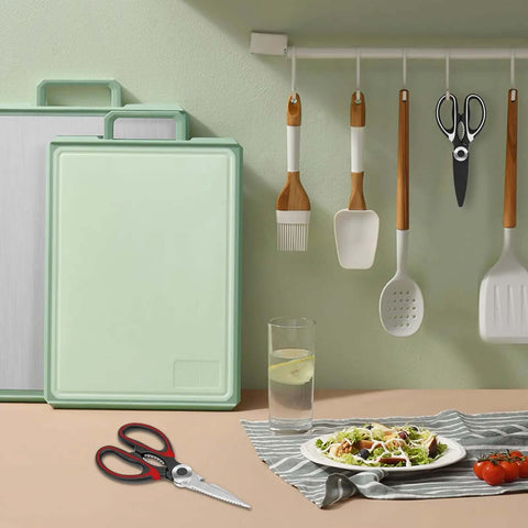 Heavy Duty Kitchen Scissors Set with 2.5mm stainless steel blades placed on a kitchen counter beside a salad and cutting boards.