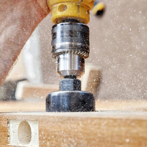Close-up of a 11 Piece Hole Saw Kit With Mandrel And Hex Key in action on wood, creating a circular cut with sawdust.
