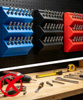 1/4 Inch Hex Bit Organizer With 21 Hole Drill Bit Holder, 45 Degree Angled Interlocking Modular Storage For Pegboard Or Wall Mount, Expandable No Drop Bit Tray For Grab And Go Garage Workshop Red mounted on pegboard