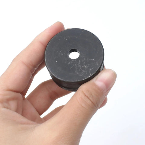 Hand holding black 6.5mm Hydraulic Hole Punch Die For CH70 Punch Machine Pro Grade Upper 40mm Mold Lower 26mm Mold