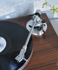 Audio-Technica At-Lpw50bt-Rw Manual Belt-Drive Turntable In Slick Rosewood with vinyl record and tonearm in focus.