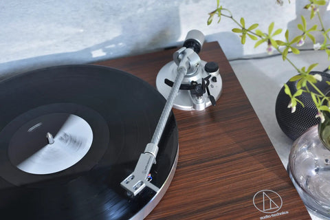Audio-Technica At-Lpw50bt-Rw Manual Belt-Drive Turntable In Slick Rosewood with vinyl record and tonearm in focus.
