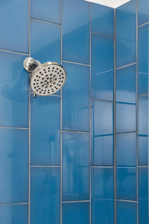 Westchester Shower Trim Kit With Single Handle 14S Brushed Nickel mounted on blue tiled wall showing shower head detail