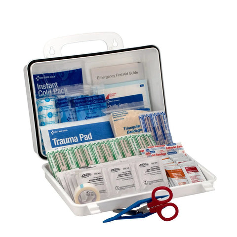 First Aid Only 25-person contractor kit in white plastic case, open to show bandages, trauma pad, gauze, scissors, tape.