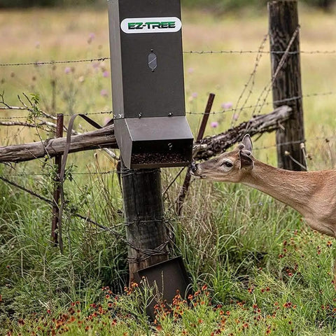 EZ Deer Tree All Season Protein Feeder In Green Hides And Dispenses Corn Rice Bran Nut Blocks Efficiently Keeps Wildlife Attractants Fresh Safe For Your Farm Yard Setup Easy Install Design