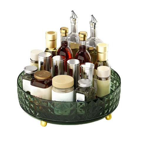 9 Inch Lazy Susan Turntable One Tier Spinning Organizer For Kitchen And Pantry Grab And Go Convenience Cabinet Refrigerator 360 Degree Rotating Spice Rack Dark Green Non Slip Surface Keeps Spices Easy Reach And Neatly Organized In Any Cabinet shown holding assorted spice jars and bottles with a textured rim.