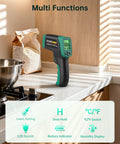 Dual Mode Infrared Thermometer Gun With Laser shown on kitchen counter with LCD display, near flour and cookware