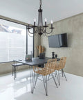 Dope Five Light Farmhouse Chandelier Black Candle Style Ceiling Light Fixture in modern dining room setting