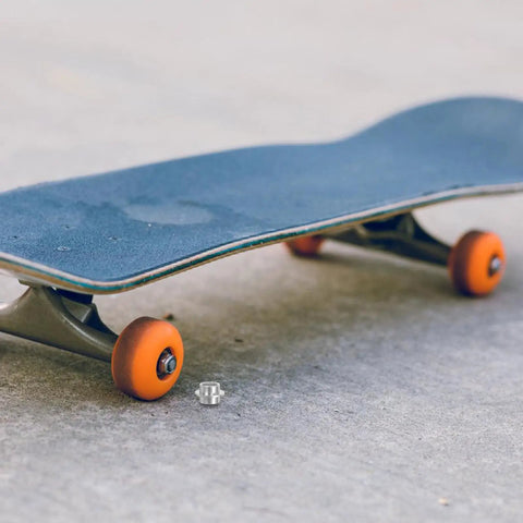 Rad High Quality Pro Grade Aluminum Skateboard Bearing Spacers Hardware Kit 30 Pcs self-centering spacer beside orange wheel