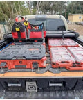 Compact Low Profile Packout Compatible Five Compartment Tool Organizer with bins on a truck bed, organized for workshop use.