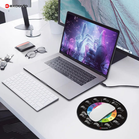 Round Mouse Pad With Circle Of Fifths Design next to laptop and keyboard on desk