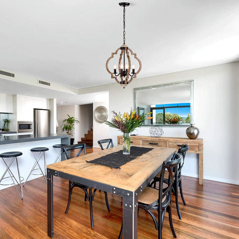 Dining area with Openwork Quatrefoil Modern Farmhouse Chandelier handcrafted wood frame in oak finish four light pendant ceiling fixture.