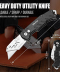 Black heavy-duty utility knife with stainless steel blade, shown open and folded, with measurements 6.69in and 4.33in.