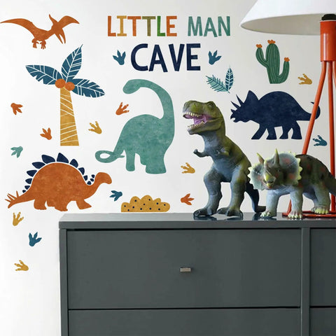 Peel And Stick Dino Footprints Wall Decals For Nursery And Playroom Baby Room Art Watercolor Blue Coconut Trees Cactus Jungle Theme Decor For Kids Room Gift featuring dinosaurs and plants on wall.