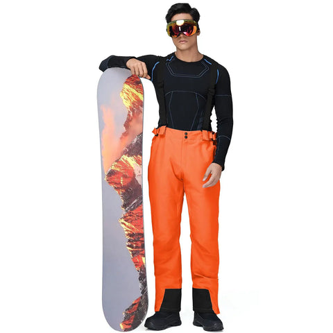 Man in Men's Insulated Snow Bibs With Detachable Suspenders Warm Waterproof Ski Pants For Cold Powder Days Four Way Stretch Snowboard Overalls.