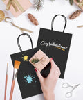 Black Kraft Paper Gift Bags With Handles 5.25 X 3.75 X 8 Inches Pack Of 20,000 styled with brushes and gift boxes