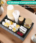 Wooden Coffee Bar Organizer With Four Compartments And Removable Dividers For Home And Office Kitchen Station Keeps Pods Sugar Packets Tea Bags Creamers And Condiments Neat And And Super Easy To Grab, displayed on a countertop, holding coffee pods and condiments.