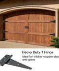 Badass 10 Inch Heavy Duty Gate Hinges 2 Pack Wrought Iron T Straps mounted on rustic wooden barn doors.